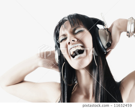 Pacific Islander woman listening to headphones 11632459