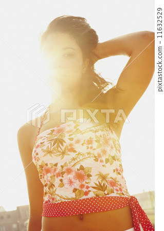 Hispanic woman in sunlight 11632529