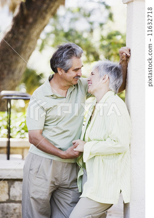 Middle-aged couple holding hands 11632718