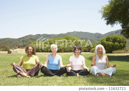 Multi-ethnic senior women meditating 11632721