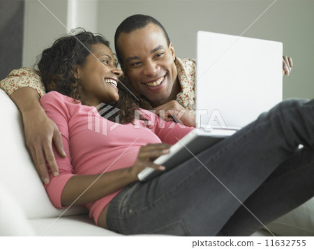 African couple with laptop  11632755