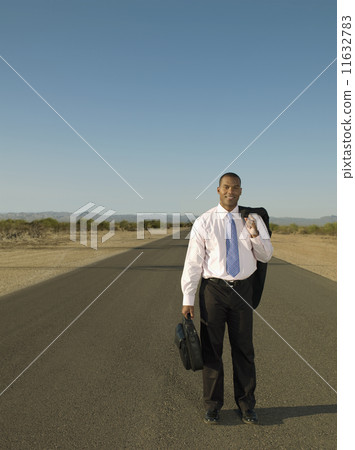 African businessman holding jacket over shoulder 11632783