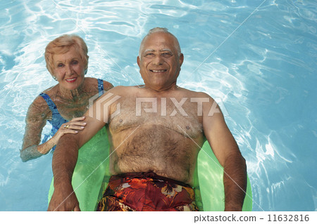 Multi-ethnic senior couple in swimming pool 11632816