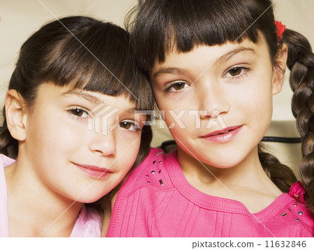 Young Hispanic sisters smiling Young Hispanic sisters smiling 11632846
