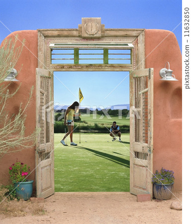 View through doorway to couple playing golf 11632850