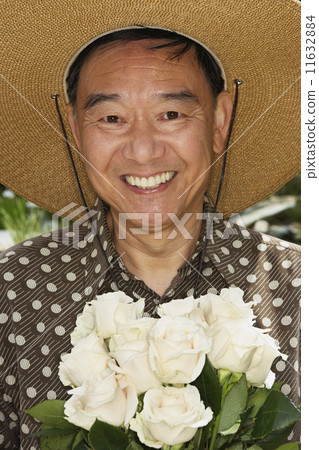 Senior Asian man holding flowers Senior Asian man holding flowers 11632884