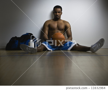 African American man holding basketball African American man holding basketball 11632964
