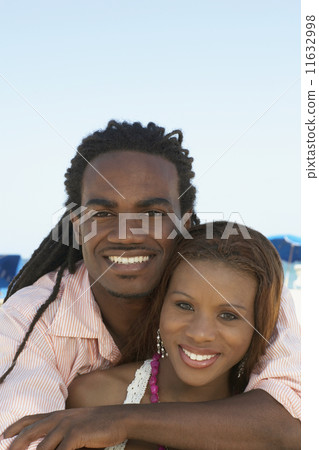 Multi-ethnic couple hugging Multi-ethnic couple hugging 11632998