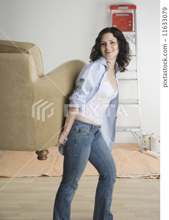 Portrait of woman moving furniture Portrait of woman moving furniture 11633079