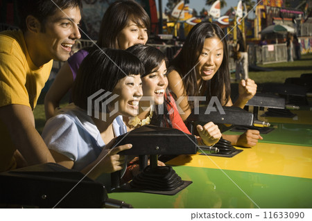 People playing with a fairground attraction 11633090
