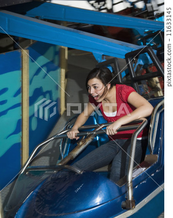 Mixed Race teenaged girl on carnival ride 11633145