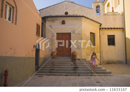 Hispanic woman at historic church 11633187