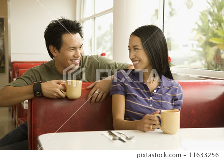 Asian couple smiling at each other 11633256