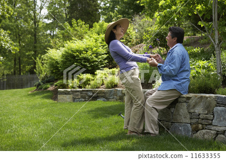 Hispanic couple laughing 11633355