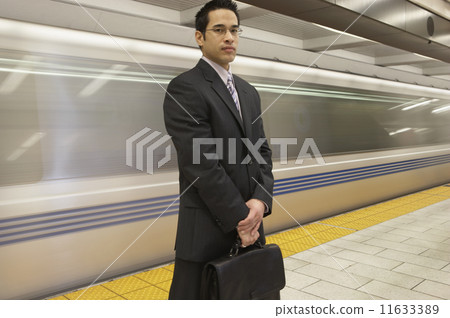 Portrait of businessman in front of subway 11633389