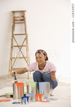 Asian woman with painting supplies 11633457