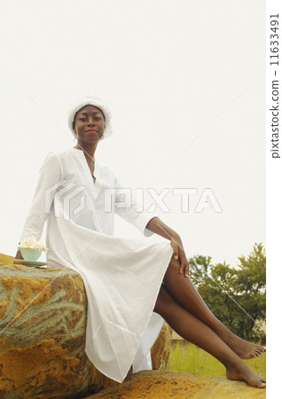 African American woman sitting outdoors African American woman sitting outdoors 11633491