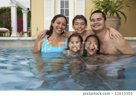Multi-ethnic family in swimming pool Multi-ethnic family in swimming pool 11633505