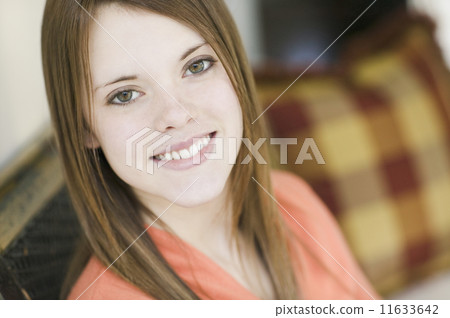 Close up of young woman smiling Close up of young woman smiling 11633642