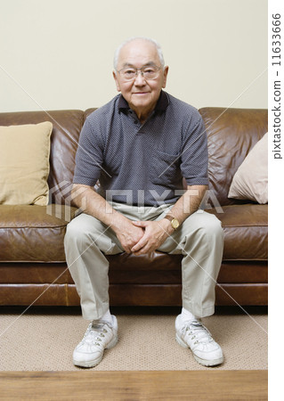 Portrait of elderly man sitting on couch Portrait of elderly man sitting on couch 11633666