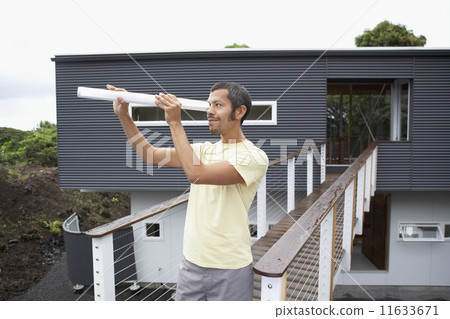 Native American man in front of house Native American man in front of house 11633671