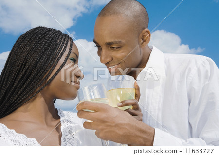 African couple drinking wine 11633727