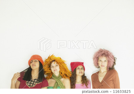 Group of young women sitting together 11633825