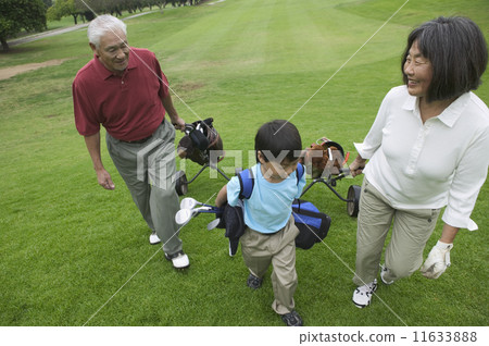 Grandparents playing golf with grandson Grandparents playing golf with grandson 11633888