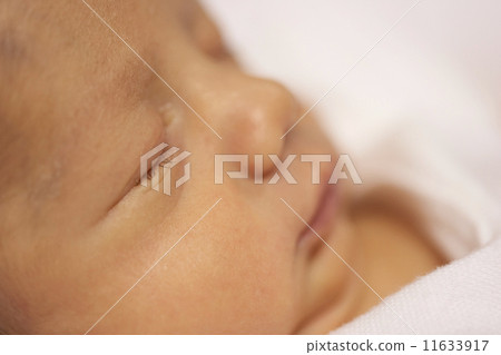 Close up of Hispanic newborn baby sleeping 11633917
