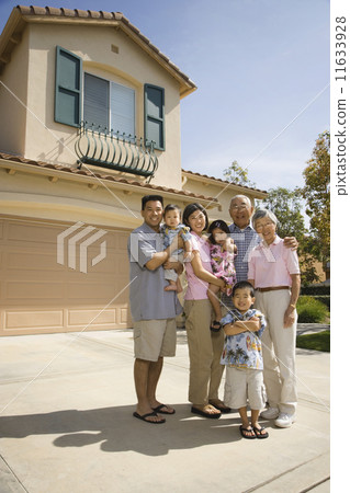 Multi-generational Asian family in driveway 11633928