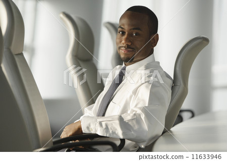 African American businessman sitting in chair 11633946