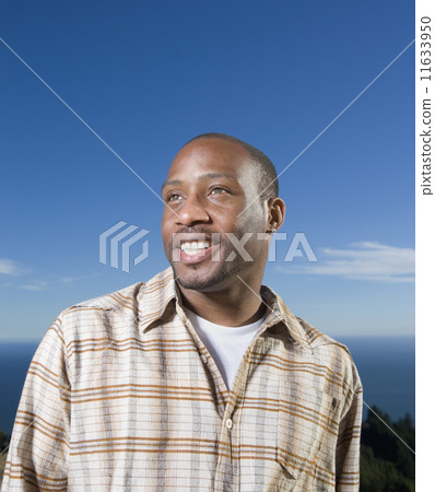 African American man under blue sky African American man under blue sky 11633950