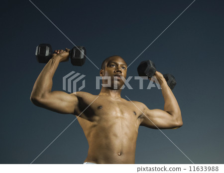 African American man lifting weights African American man lifting weights 11633988