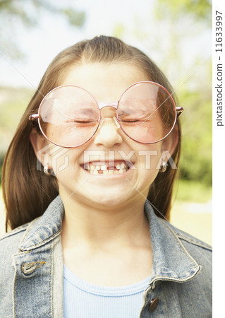 Hispanic girl wearing big glasses 11633997