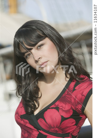Portrait of Hispanic woman outdoors Portrait of Hispanic woman outdoors 11634107