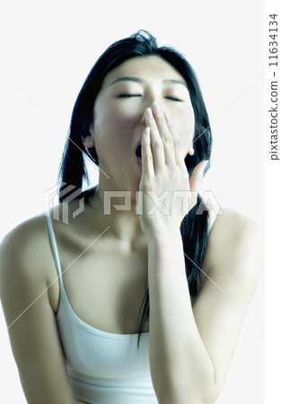 Young woman yawning 11634134