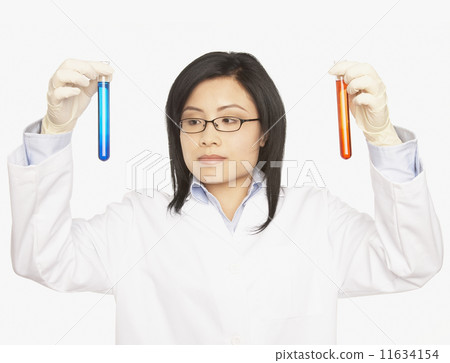 Asian female scientist holding vials 11634154