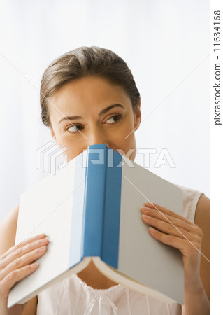 Woman holding open book Woman holding open book 11634168