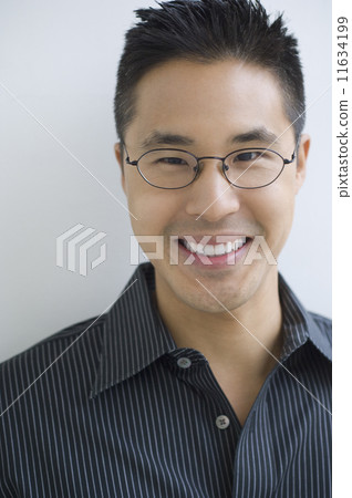 Asian man wearing eyeglasses 11634199