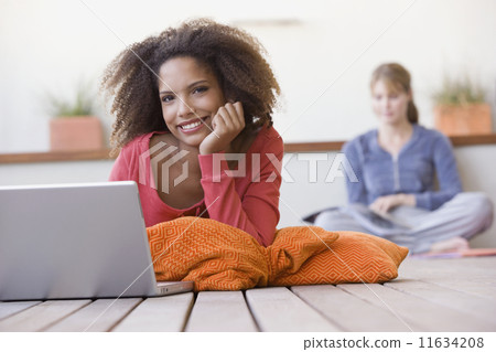 African woman next to laptop African woman next to laptop 11634208