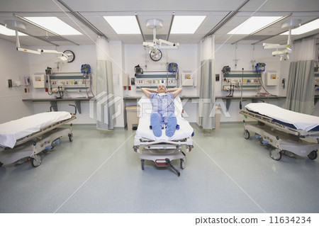 Doctor sleeping in hospital bed 11634234