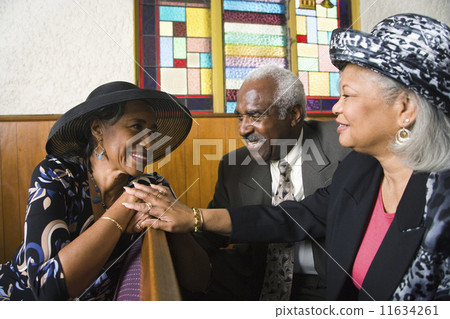 African American senior talking in church African American senior talking in church 11634261