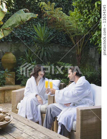 Multi-ethnic couple drinking cocktails Multi-ethnic couple drinking cocktails 11634345