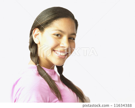 Studio shot of Hispanic girl smiling 11634388