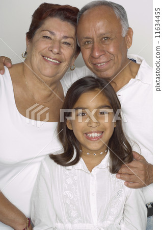 Portrait of Hispanic grandparents and granddaughter Portrait of Hispanic grandparents and granddaughter 11634455