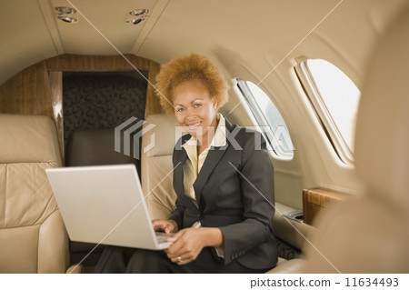 African American businesswoman on airplane 11634493