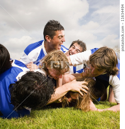 Multi-ethnic male soccer players having fun 11634494