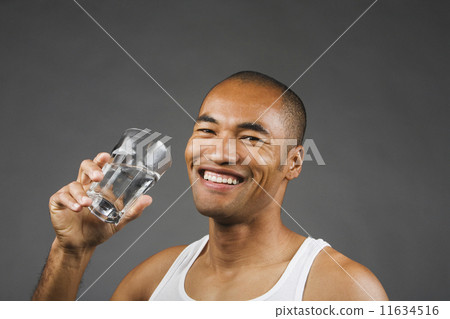 Portrait of Asian man drinking glass of water Portrait of Asian man drinking glass of water 11634516