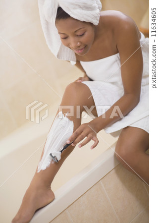 African woman shaving legs African woman shaving legs 11634605