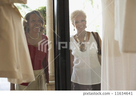 Senior African American women window shopping Senior African American women window shopping 11634641